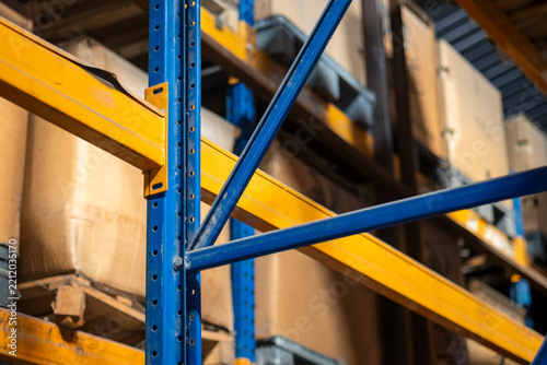 Industrial warehouse metal racking structure. Suitable for supply chain logistics, inventory management concepts, and storage facility design assets, and creative marketing. Selective focus.