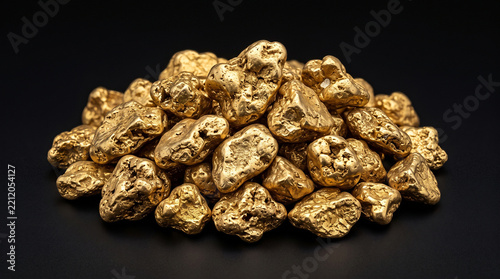 A pile of raw gold nuggets clustered together on a clean solid black background surface with dense collection raw rests pile against accumulation prospecting with investment