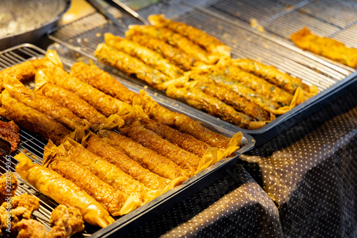 an iconic Asian night market staple—traditional Taiwanese deep-fried chicken rolls