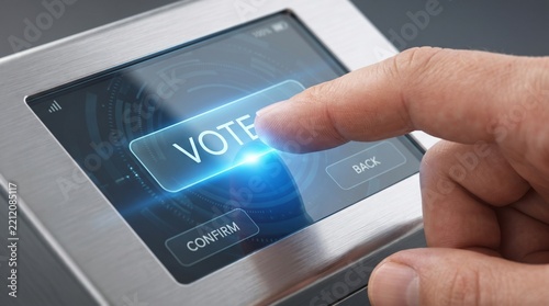 Finger pressing a digital vote button on a modern electronic