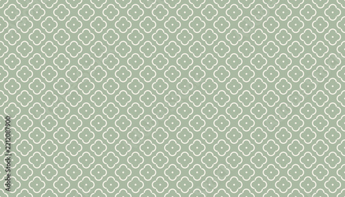 Seamless Moroccan quatrefoil lattice pattern in cream on sage green