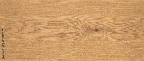 Fotografie Oak wood grain texture with a distinct central knot hole and warm honey tones cr