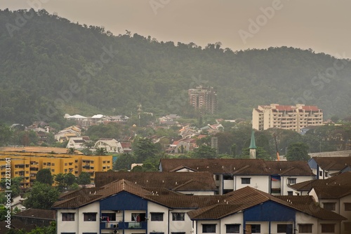 Keramat, Malaysia - July 6, 2022 the famous abandoned condominium Highland Tower surrounded by modern neighbourhood