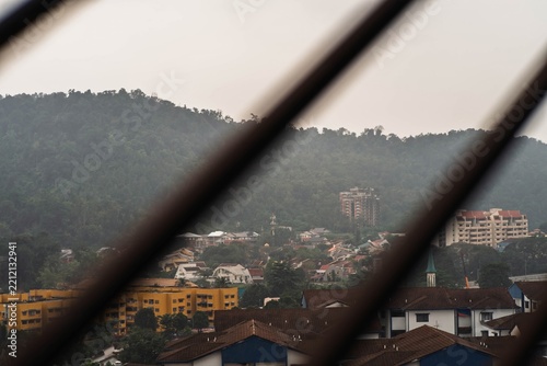 Keramat, Malaysia - July 6, 2022 the famous abandoned condominium Highland Tower surrounded by modern neighbourhood