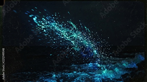 Bioluminescent Plankton Glowing in Ocean Waves at Night, Magical Blue Sea Sparkles, Natural Phenomenon Stock Photo