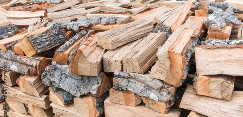 Pile of chopped firewood. Chopped firewood logs stacked