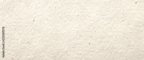 Light cream handmade paper texture background with organic fibers