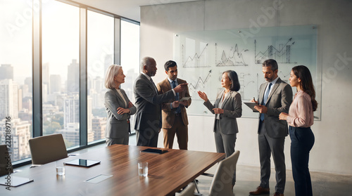 Professionals discussing in modern meeting room