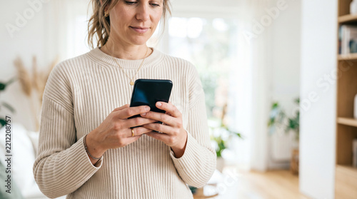 young woman texting on mobile phone