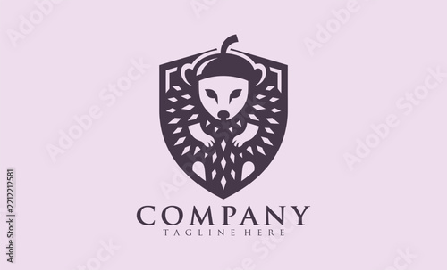 A minimalist logo featuring a stylized bear head with leaf-like patterns inside a shield emblem