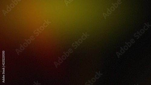 Abstract dark background with soft gradient blending of dark green, brown, and warm tones