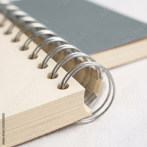 Spiral-bound notebook with wire binding and blank pages  