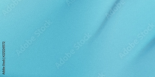 A close up view of soft light blue fabric with subtle folds creating a gentle gradient effect