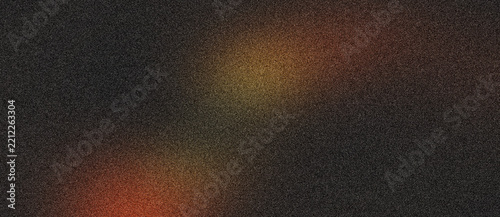 Dark grainy texture background with warm orange and yellow light leaks for creative design.