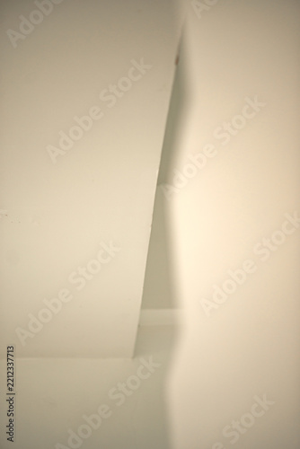 Abstract view of light and shadow interplay on white interior walls