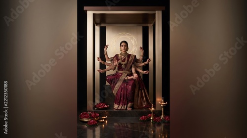 Goddess durga idol standing in a decorative shrine