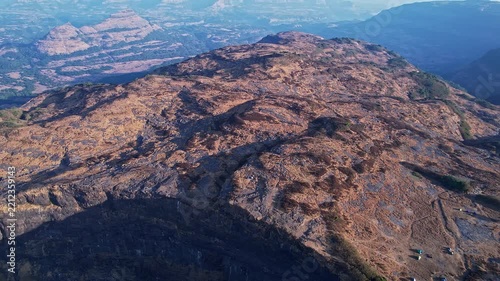 Bird eye view of majestic mountain ridges across breathtaking wilderness and horizon landscapes