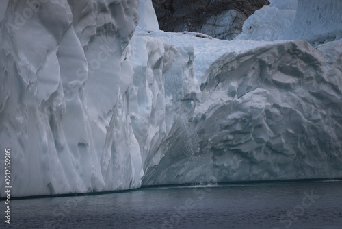 Close up of glacier calving into the ocean