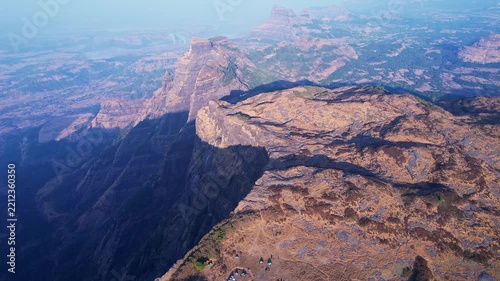 Bird eye view of majestic mountain ridges across breathtaking wilderness and horizon landscapes