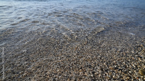 Pure Coastal Waters and Wet Sand Texture