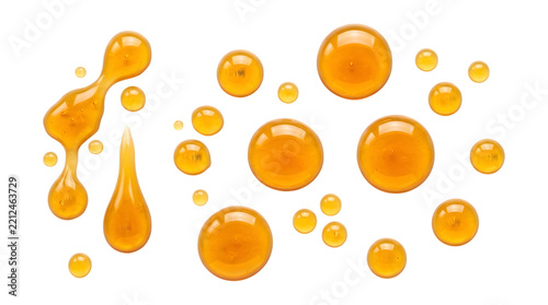 Honey drops and golden syrup splashes isolated on transparent background