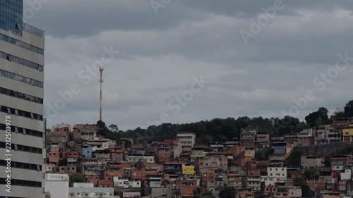 Modern Residential Tower Over Dense Hillside Favela Neighborhood