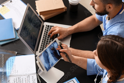 Medical diagnosis and healthcare collaboration, doctors analyzing chest x-ray...