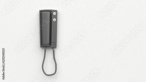 Black intercom on white wall