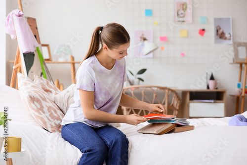 Homeschooling and remote learning, student studying with books and notebooks ...