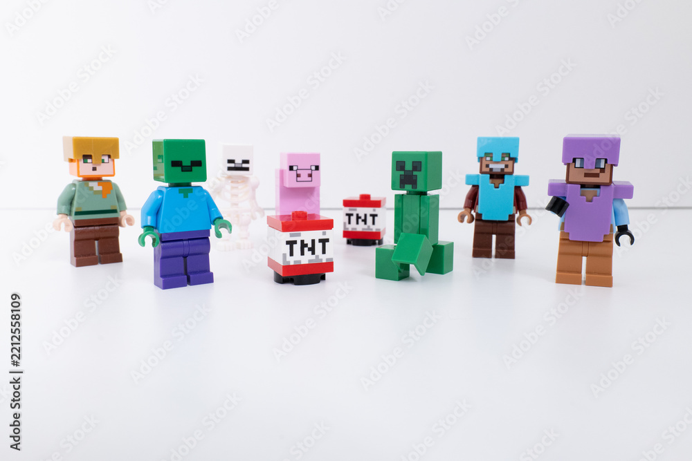 Naklejka premium Lego Minecraft mini-figures and TNT blocks shot isolated on a white background. inclides - Steve, Creeper, Pig, & Skeleton. Bradford, UK Oct 2 2026