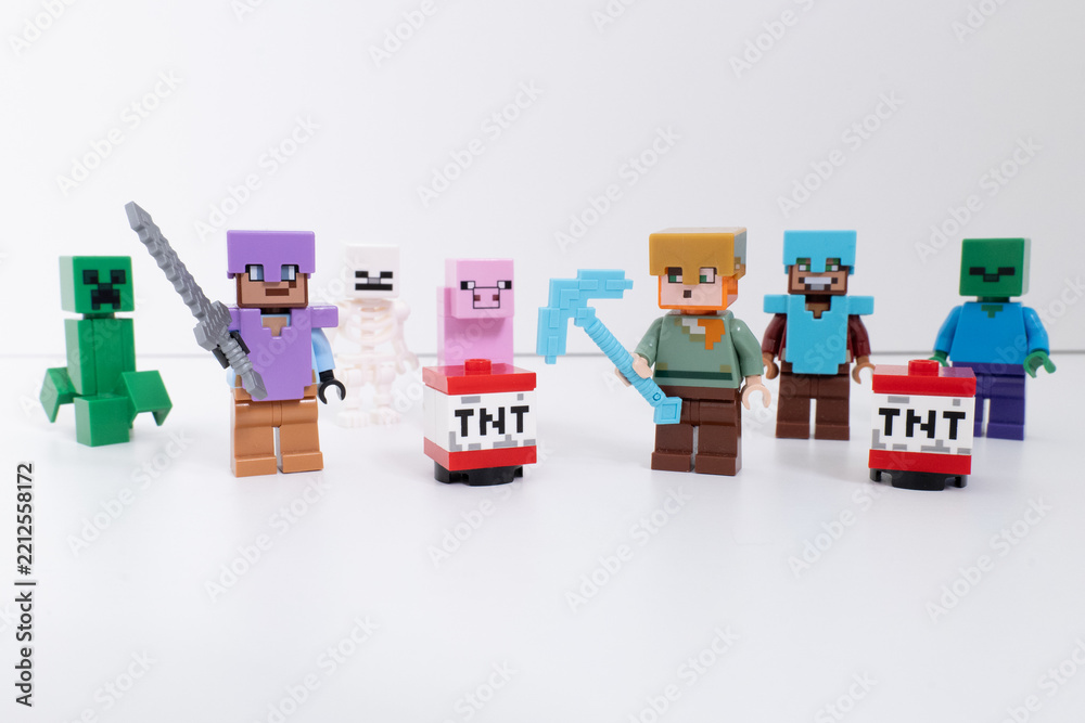 Naklejka premium Lego Minecraft mini-figures and TNT blocks shot isolated on a white background. inclides - Steve, Creeper, Pig, & Skeleton. Bradford, UK Oct 2 2026