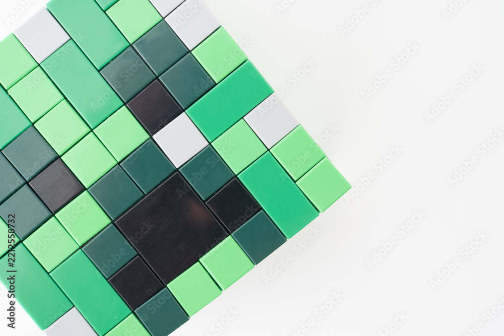 Naklejka premium A green Lego Minecraft creeper head shot isolated on a white background. Bradford, UK Oct 2 2026