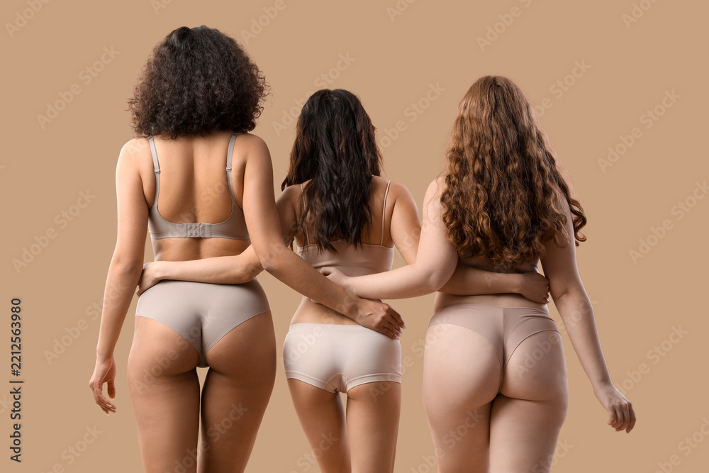 Fototapeta premium Body positivity and female empowerment, diverse women with different body types standing together in underwear on a neutral background