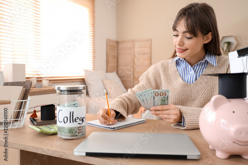 College savings and student debt, young woman planning education budget with ...