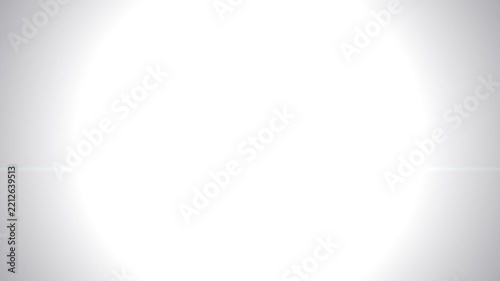 Bright white flare with subtle light leak on a grey background for abstract design or overlay effect.
