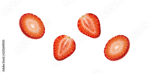 Fresh red strawberry slices floating on transparent background