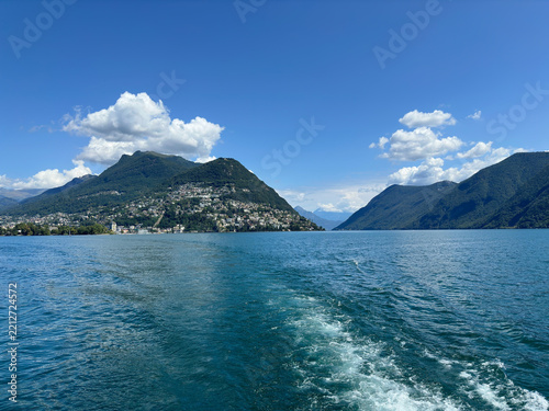 Lake Lugano with mountains and blue sky, Switzerland