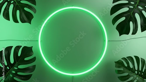 Glowing Neon Green Ring Surrounded by Tropical Monstera Leaves in Lush Backdrop