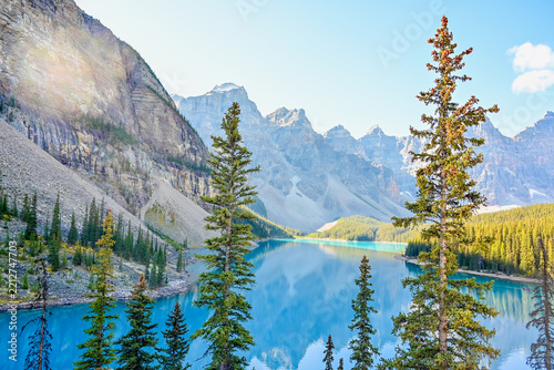 Turquoise Moraine Lake reflecting Valley of the Ten Peaks and pine forest in Banff National Park, Canada.