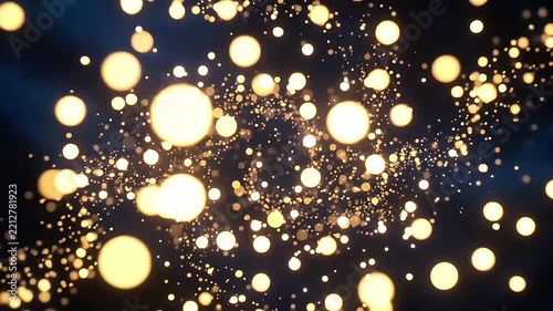 Golden glowing particles and soft bokeh lights floating through a dark space with depth of field. Abstract, dreamy motion graphics style with warm sparkling glow, ideal for holidays, New Year