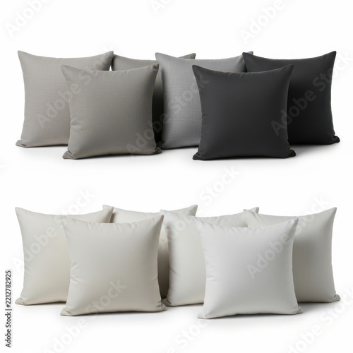 Collection of decorative throw pillows in shades of gray and white with cushions