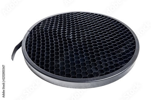 Circular honeycomb grid light modifier with metallic frame for precise directional control in professional photography lighting