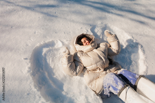Winter Fun in Snow While Making Snow Angels And Happiness