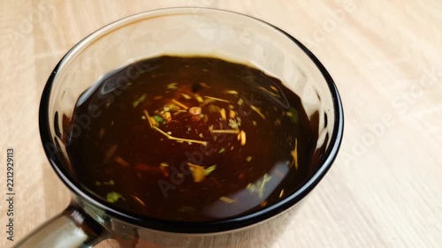 Herbal tea. Brew a healthy herbal tea in a glass mug. Herbal tea, homeopathic beverage