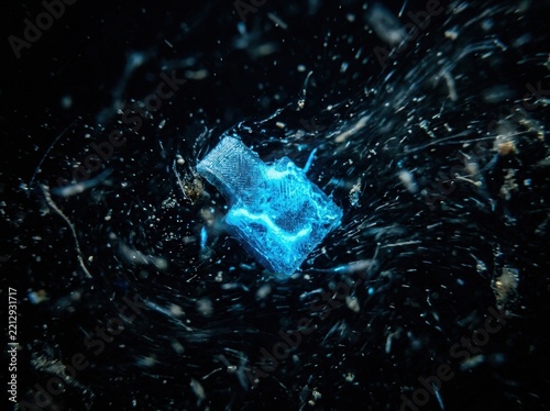 Abstract Blue Glow Particle Explosion in Dark Space