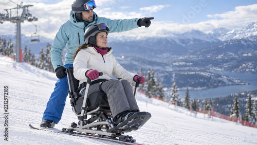 Adaptive Sit Ski Team Descending Snowy Mountain Slope Together
