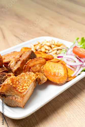 Peruvian chicharron pork with sweet potato and sarza criolla