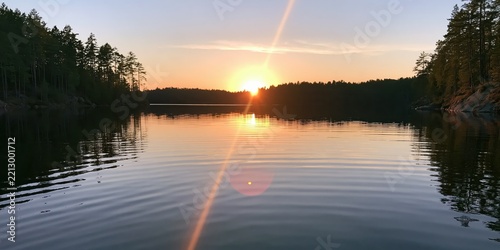 Sunset over lake with forest