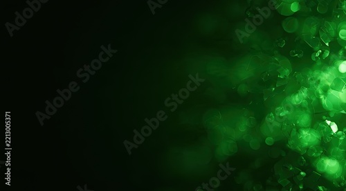 Abstract green bokeh lights transition from dark to vibrant, creating depth