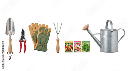 Gardening tools set with trowel rake gloves seed packets arranged together isolated on white background for home horticulture